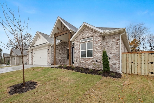 view of front facade featuring a garage and a front lawn