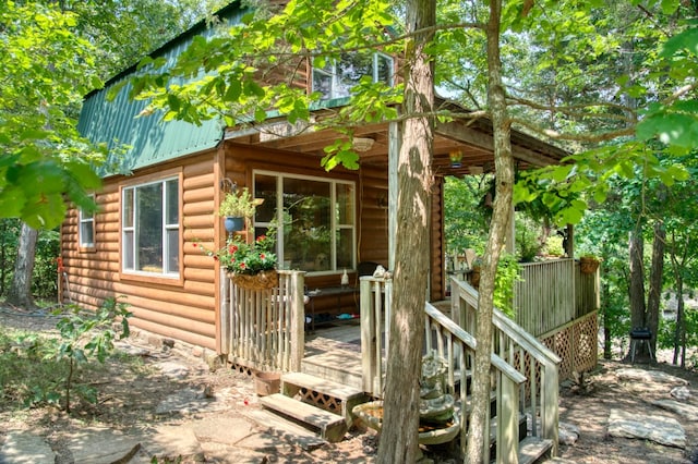 view of property exterior featuring a deck