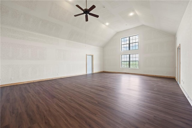 additional living space with dark wood-type flooring, high vaulted ceiling, a ceiling fan, and baseboards