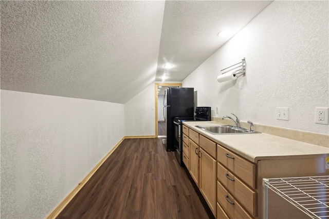 kitchen with a sink, a textured ceiling, electric range oven, lofted ceiling, and dark wood-style floors