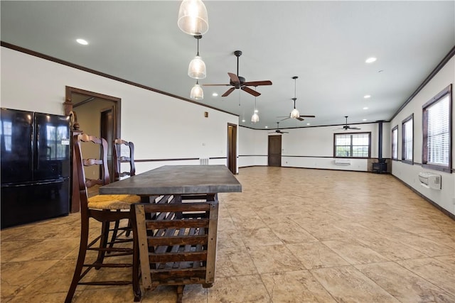 dining space with baseboards, a ceiling fan, crown molding, and recessed lighting