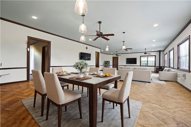 dining space featuring light parquet flooring, ornamental molding, and ceiling fan