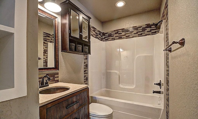 full bathroom with vanity, toilet, and washtub / shower combination