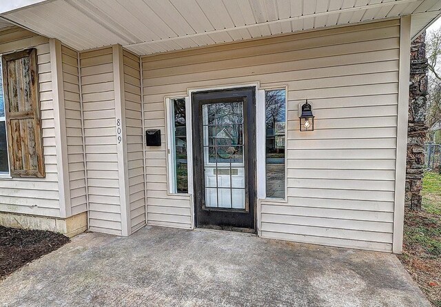 property entrance featuring a patio area