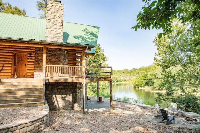 exterior space featuring a patio area and a water view