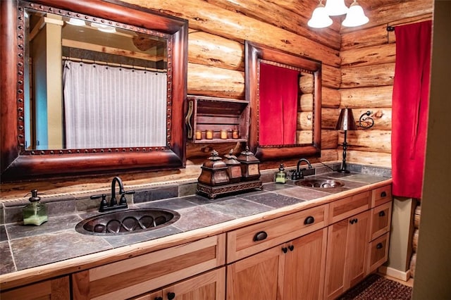 kitchen featuring an inviting chandelier, sink, and log walls