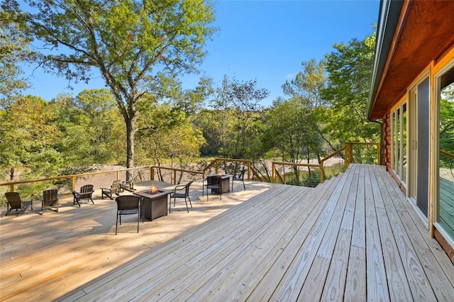 deck featuring an outdoor fire pit