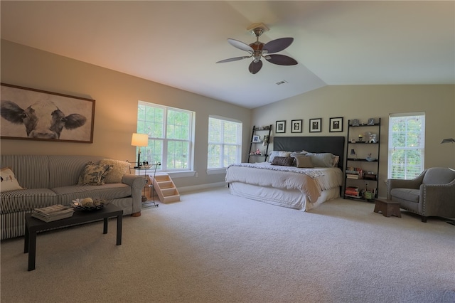 bedroom featuring carpet, lofted ceiling, and ceiling fan