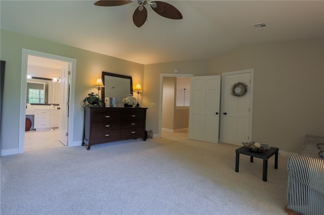 living area with lofted ceiling, light colored carpet, and ceiling fan