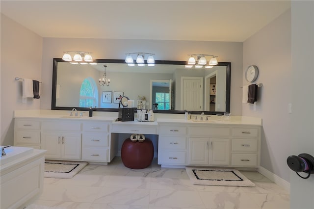 bathroom with vanity and an inviting chandelier