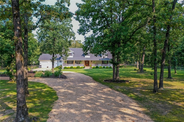 view of front of property with covered porch and a front yard