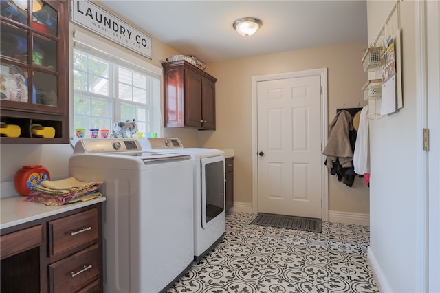 laundry area with cabinets and independent washer and dryer