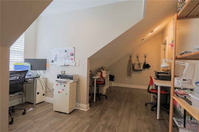 office space with dark wood-type flooring and vaulted ceiling