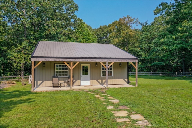 bungalow featuring a front yard and a patio