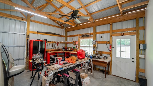 garage with a workshop area and ceiling fan