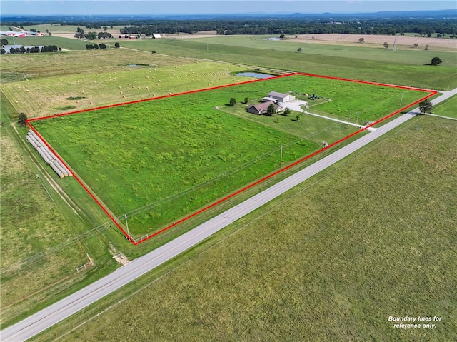 birds eye view of property featuring a rural view