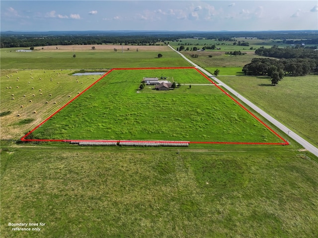 birds eye view of property with a rural view