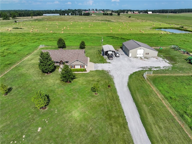 drone / aerial view featuring a water view and a rural view