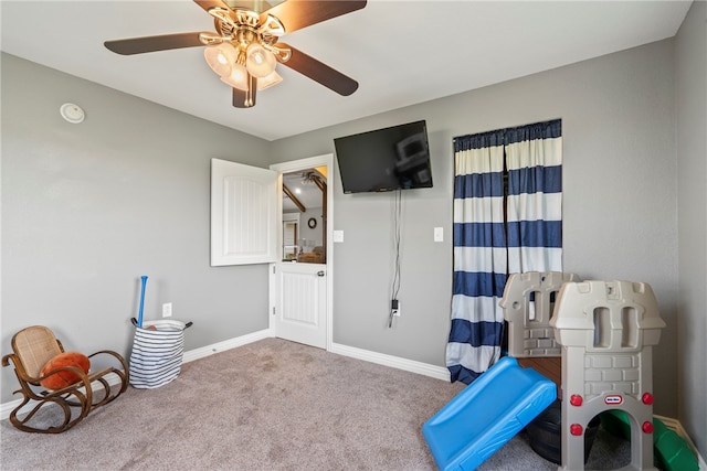 game room with carpet floors and ceiling fan