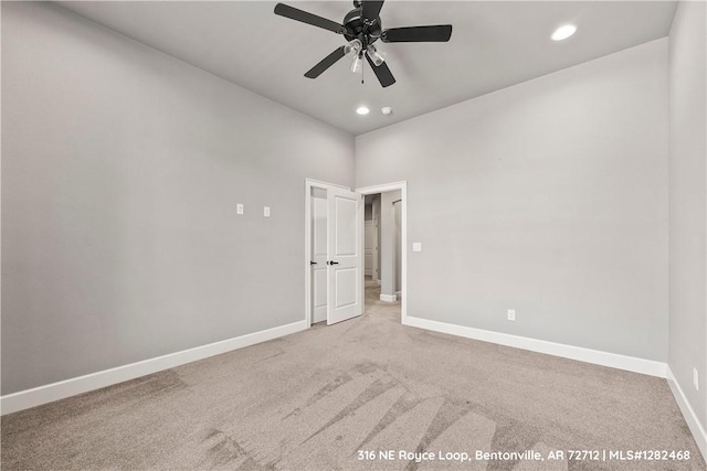 empty room with carpet floors and ceiling fan