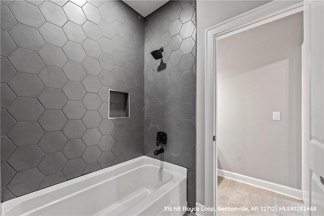 bathroom featuring tile patterned flooring and washtub / shower combination