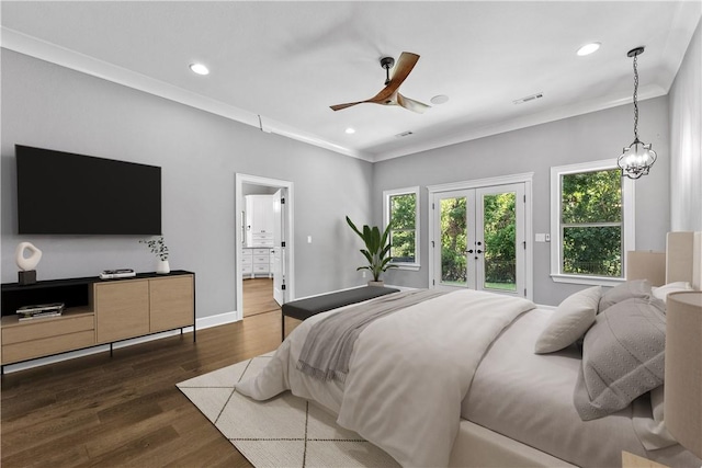 bedroom featuring access to outside, french doors, ceiling fan with notable chandelier, crown molding, and dark hardwood / wood-style floors