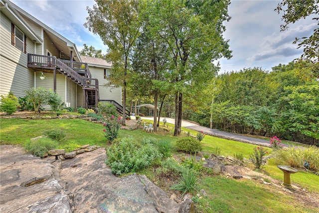 view of yard with a wooden deck