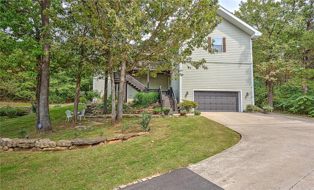 view of front of property featuring a garage and a front yard