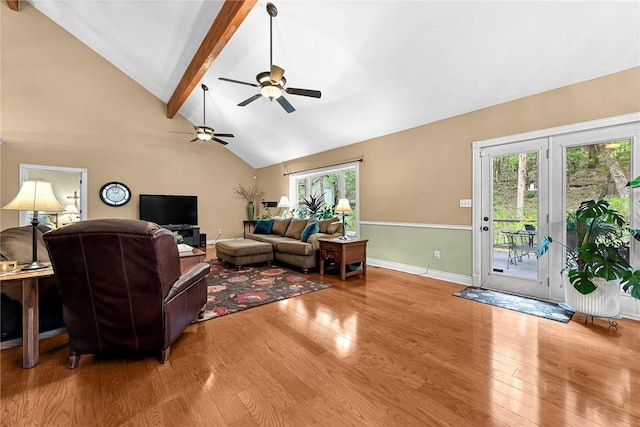 living room featuring hardwood / wood-style floors, high vaulted ceiling, and beamed ceiling