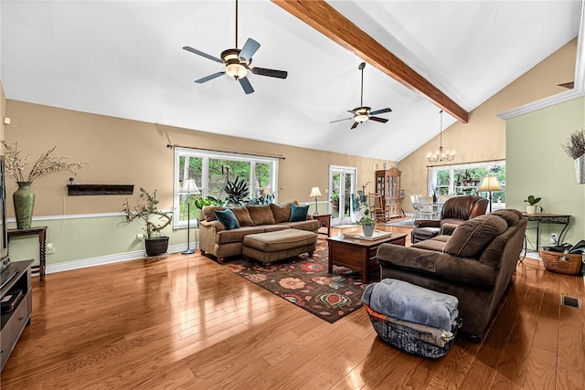 living room featuring beamed ceiling, high vaulted ceiling, hardwood / wood-style floors, and a wealth of natural light