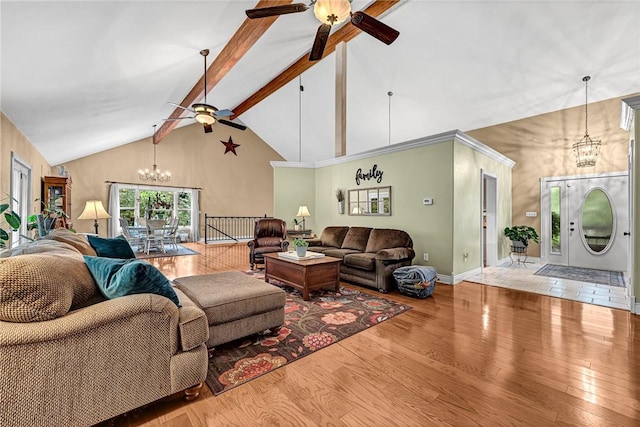 living room featuring beam ceiling, hardwood / wood-style flooring, ceiling fan with notable chandelier, and high vaulted ceiling