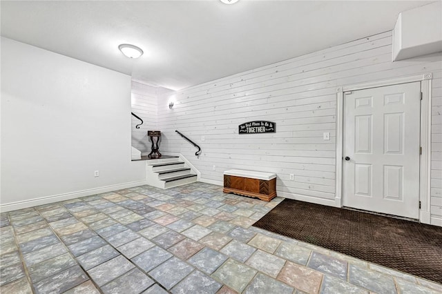 interior space featuring wood walls