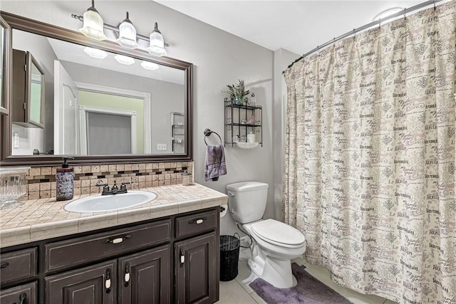 bathroom featuring toilet, vanity, a shower with shower curtain, tile patterned flooring, and decorative backsplash