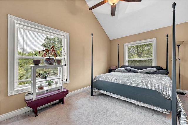 bedroom featuring lofted ceiling, ceiling fan, and carpet flooring