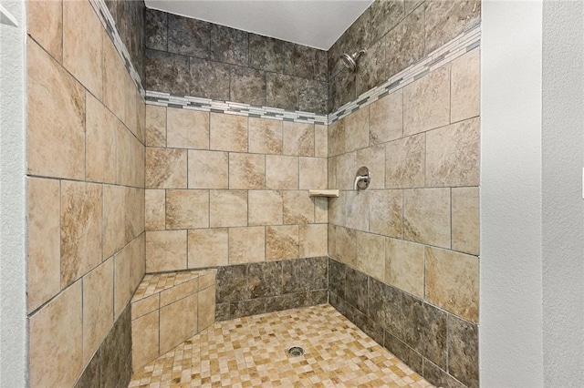 bathroom featuring tiled shower