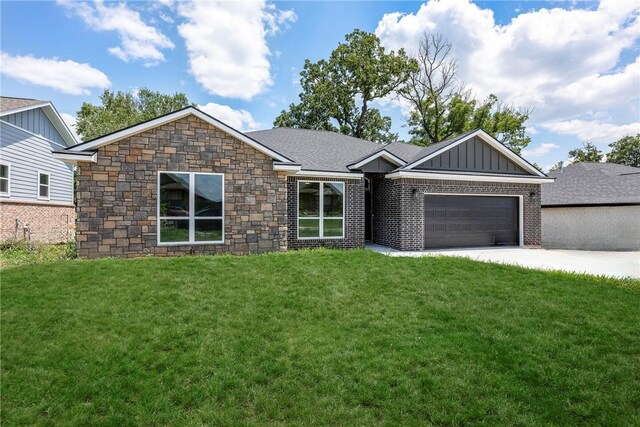 ranch-style home with a garage and a front lawn