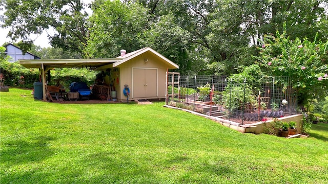 view of yard featuring a garden, a shed, and an outbuilding