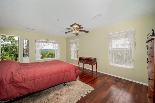 bedroom featuring dark wood-type flooring and ceiling fan