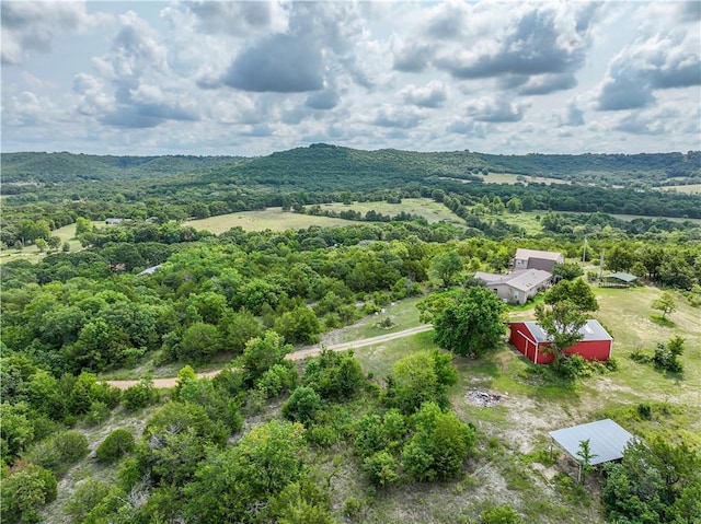 birds eye view of property with a view of trees