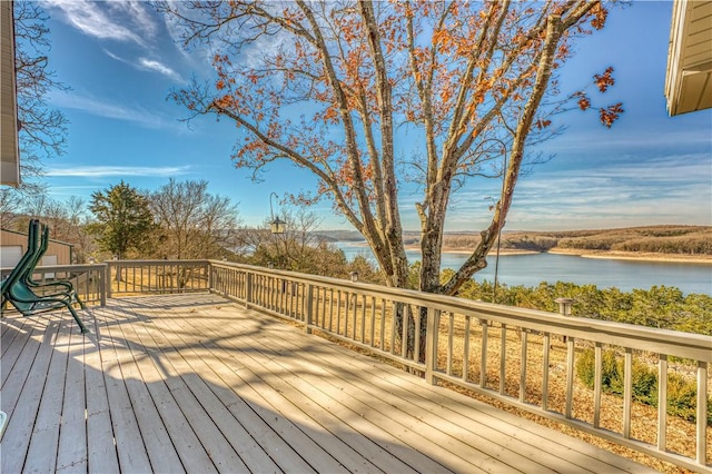 wooden deck with a water view