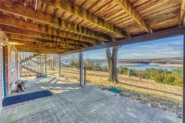 view of patio with a water view