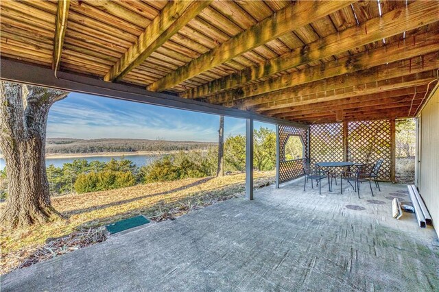 view of patio with a water view