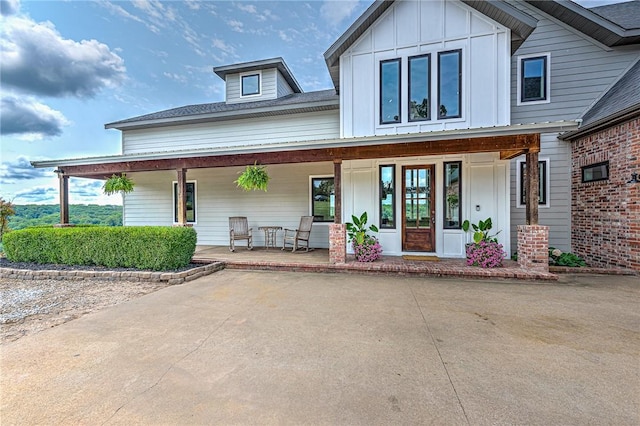 view of front of home featuring covered porch and board and batten siding