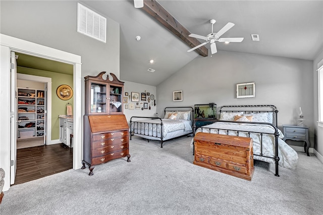 bedroom with wood-type flooring, ceiling fan, high vaulted ceiling, a walk in closet, and beam ceiling