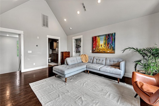 living area with wood finished floors, high vaulted ceiling, baseboards, and recessed lighting