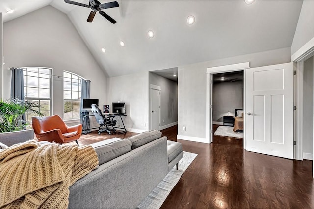 living area with high vaulted ceiling, an office area, ceiling fan, baseboards, and wood finished floors