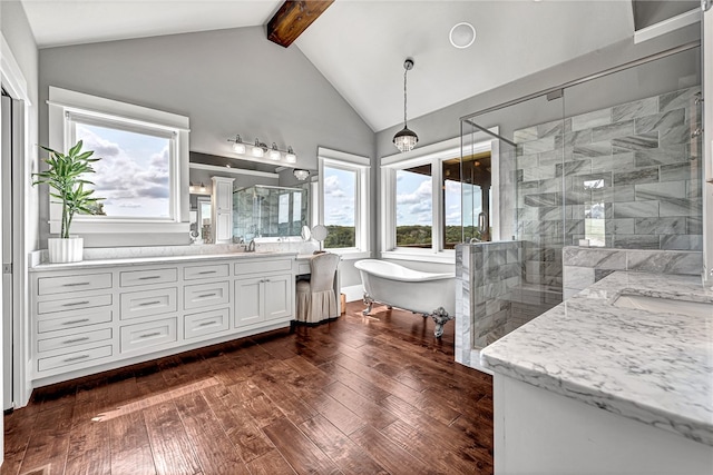 bathroom featuring double vanity, separate shower and tub, wood-type flooring, and lofted ceiling with beams