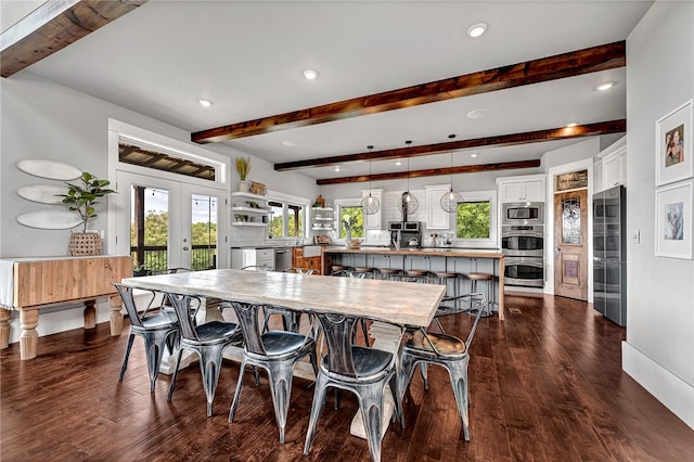 dining space featuring dark hardwood / wood-style floors, beamed ceiling, and french doors