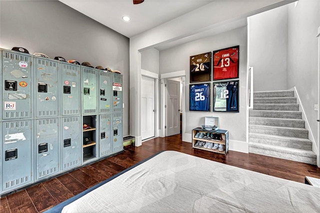 bedroom with wood finished floors, baseboards, and recessed lighting