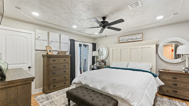 bedroom with ceiling fan and light wood-type flooring